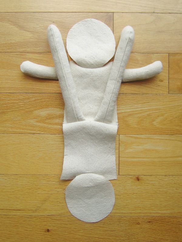 a white stuffed animal laying on top of a wooden floor