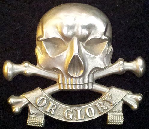 a skull and crossbones with the word gold on it