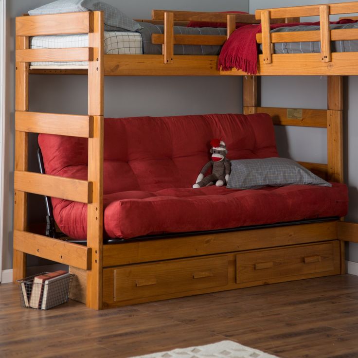 a bunk bed with futon mattress and pull out sofa in the bottom level is shown