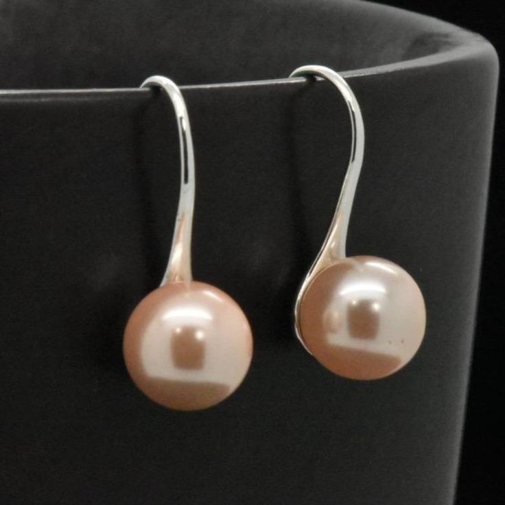 A beautiful & uniquely designed natural freshwater pearl earrings featuring a minimalistic design with french wire fastening for easy wear. The pearl is approx. 6/16-inch in diameter.FEATURES• Made from 925 sterling silver• Natural freshwater pearl (light pink)• Earring size: 7/8-inches long• Vintage minimalistic Design Pink Earring, Pearl Light, Freshwater Pearl Earrings, Freshwater Pearls Earrings, Silver Lights, French Wire, Pearl Wedding, Pink Earrings, Minimalistic Design