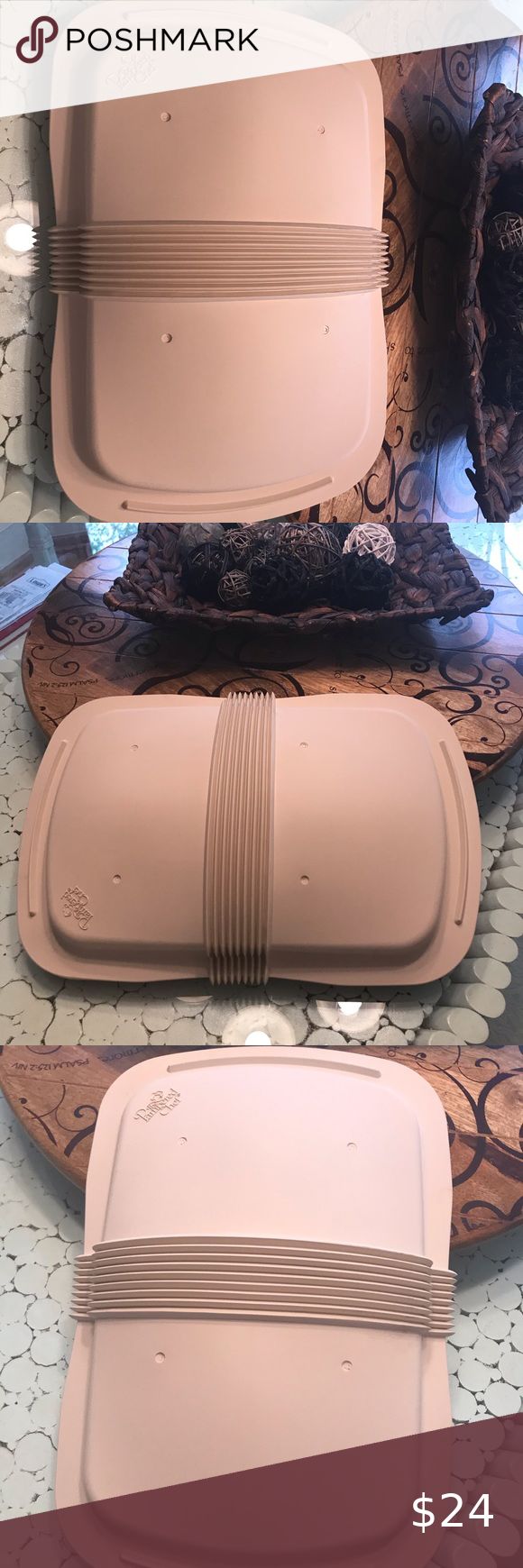 two pink plates sitting on top of a table next to each other and the words poshmark above them