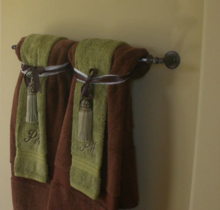 two towels hanging on the side of a wall next to each other with words saying no, don't use these they're for decoration