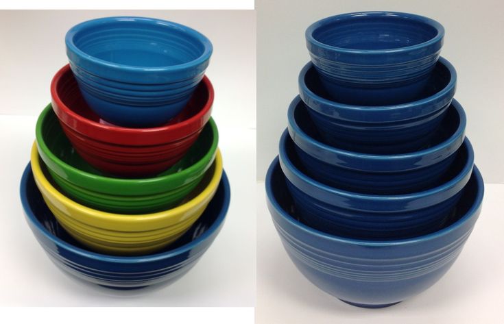 several different colored bowls stacked on top of each other