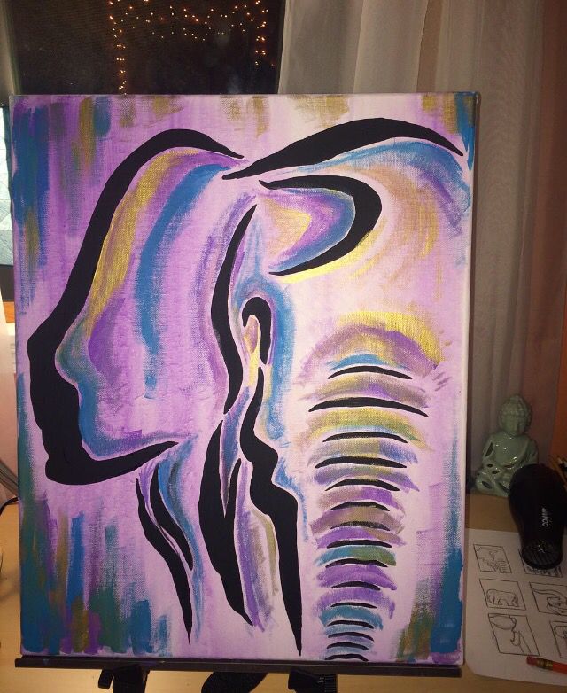 an elephant painted on canvas in front of a window