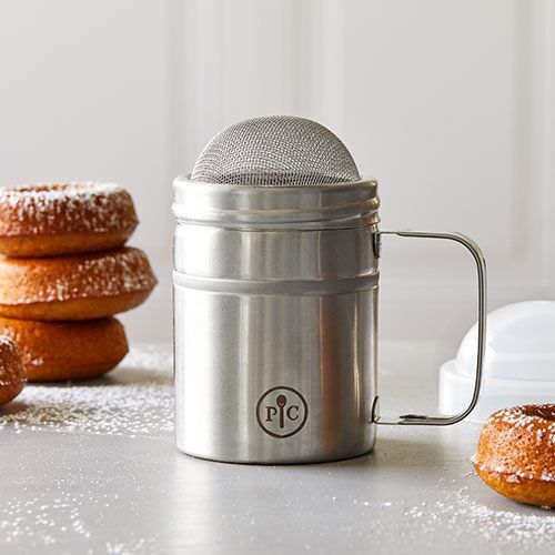 a microphone sitting on top of a table next to doughnuts