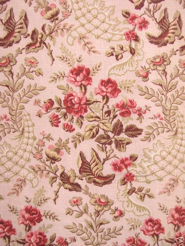 a close up view of a flowered fabric with birds and flowers on the side