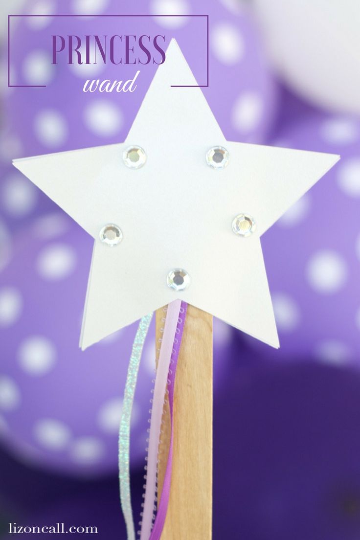 a paper star on top of a wooden stick with sparkles around it and the words princess wand