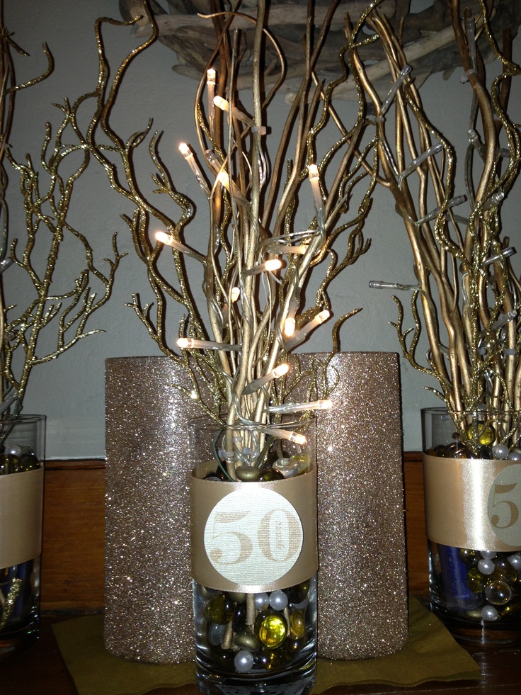 there are three vases with branches in them