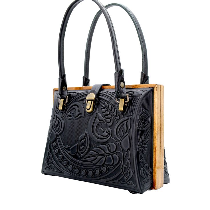 Introducing our Black Leather Bag for Women, a versatile tote purse that serves as the perfect handbag. Dimensions: 10.8 x 7.6 x 4.5 inches (27.5 x 19.5 x 11.5 cm) Material: Crafted from a combination of genuine leather and real oak wood. Please Note: The actual color of the item may vary slightly from the pictures shown on the website due to differences in monitor brightness settings on your computer. Black Box Bag With Handle Drop For Everyday Use, Everyday Rectangular Box Bag With Top Carry Handle, Rectangular Briefcase For Shopping, Evening Rectangular Briefcase, Square Briefcase With Top Carry Handle For Everyday, Rectangular Box Bag With Detachable Handle For Everyday, Everyday Rectangular Box Bag With Handle Drop, Rectangular Briefcase With Removable Pouch, Elegant Black Shoulder Bag With Monogram Print