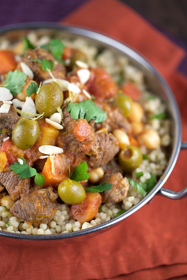 a close up of a bowl of food with rice and vegetables on the side,