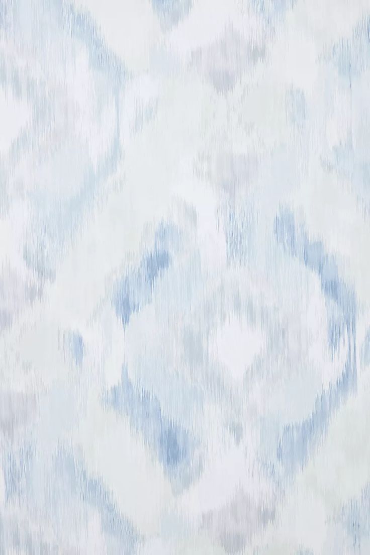 an abstract blue and white pattern on fabric