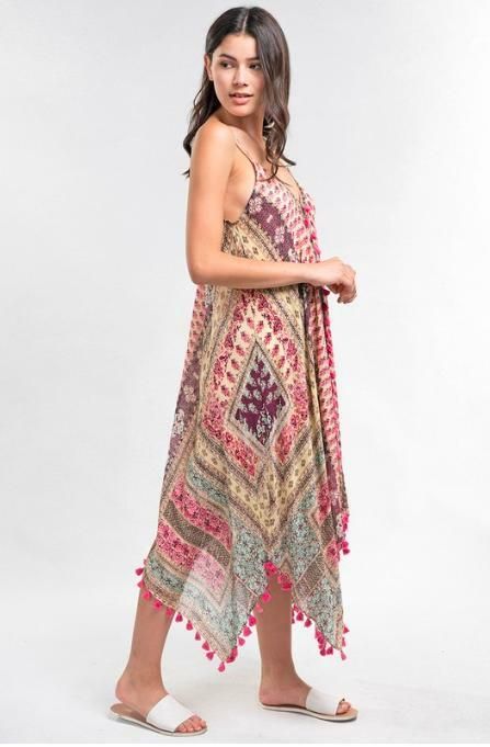 Final Sale - Get it before it's gone! For an on-point resort ensemble, reach for the Sun Kissed Pink Paisley Print Scarf Dress! Lightweight sheer dress, in hues of pink and turquoise, falls from spaghetti straps into a V-neckline into a relaxed bodice. Asymmetrical hemline with tassel trim. DETAILS & CARE Modal/Viscose. Machine wash cold. Imported. Pink V-neck Boho Dress For Beach Cover-up, Pink V-neck Boho Dress For The Beach, Pink Sleeveless Maxi Dress Beach Cover-up, Sleeveless Boho Print Dress For Beach Cover-up, Multicolor Boho Print Dress For Beach Cover-up, Beach Sundress With Paisley Print And V-neck, Pink Printed Dress For Vacation, Pink Printed Dresses For Vacation, Pink Printed Maxi Dress For Summer