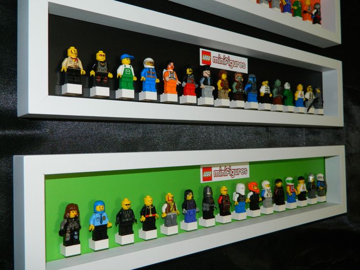 legos are displayed on the wall in front of each other with different colors and sizes