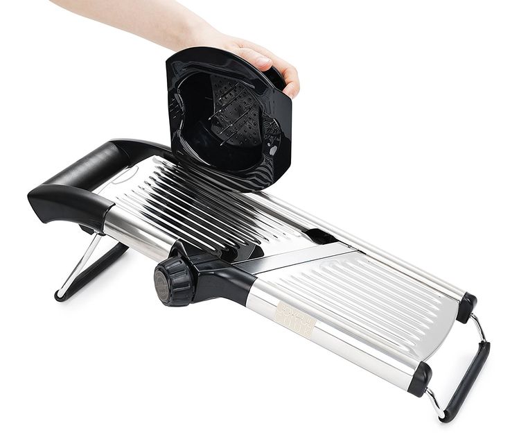 a person is using a mandolin to press something on top of a grilling pan