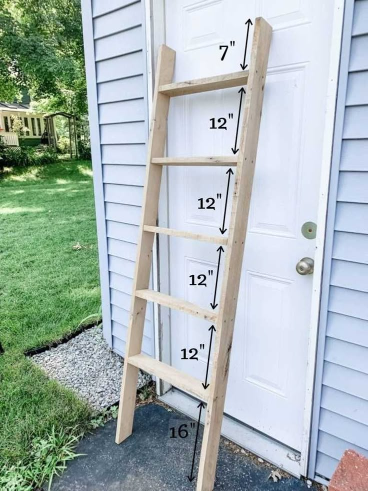 a wooden ladder leaning against a door with measurements on the outside and inside it's sides