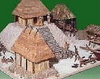 an image of a building made out of wood and straw with thatched roof on top