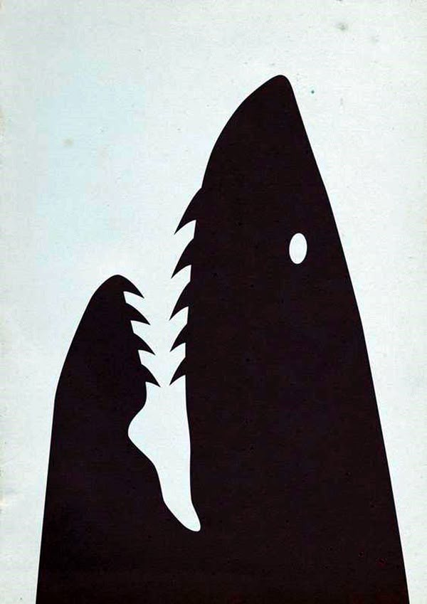 a black and white silhouette of a shark with its mouth open to bite another fish's teeth