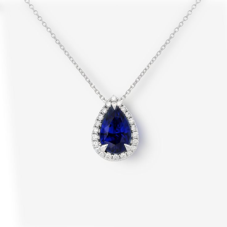 Adorn yourself with exquisite elegance and grace with our pear shaped AAA royal color blue Sapphire and Diamond necklace. An iconic piece that exudes timeless charm, this jewel symbolizes wisdom and intuition, making it a coveted gift for someone special. Natural Sapphire: 3.02cts Natural Diamonds: 0.24ctw Pendant: 18K White Gold Chain: 14K White Gold Length: 18 Inches Blue Diamond Necklace, Halo Necklace, Royal Colors, Natural Sapphire, Diamond Halo, Sapphire Diamond, Blue Diamond, Halo Diamond, Pear Shaped