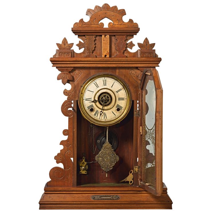 an old wooden clock with roman numerals on the front and sides, sitting against a white background