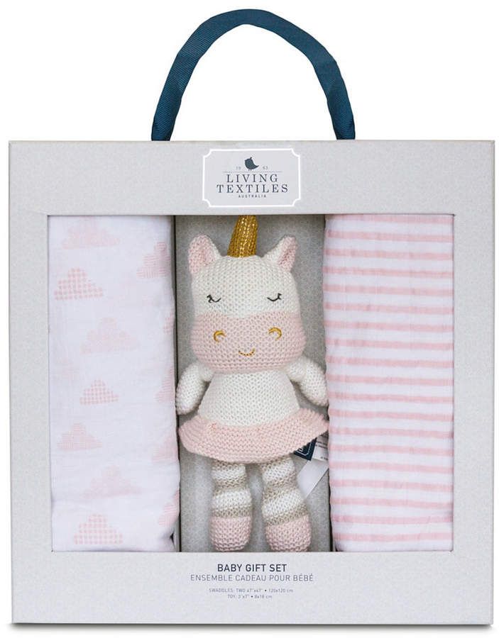 a baby gift set in a box with a unicorn doll and blanket on it's side