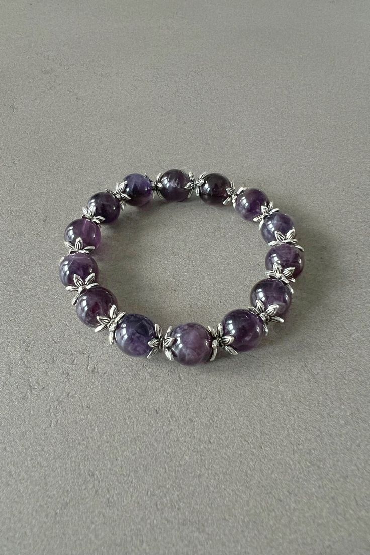 Amethyst bracelet for her amethyst beaded bracelet with natural amethyst gemstone bracelet adjustable amethyst bracelet gift for best friend Expertly crafted, this Handmade Beaded Bracelet showcases the stunning beauty of purple amethyst stones and intricate star-shaped spacers in antique silver color. Each piece is unique and adds a touch of elegance to any outfit. A true statement accessory with natural healing properties, this bracelet is a must-have for any fashion-forward individual. Intere Amethyst 8mm Beads Jewelry Gift, Amethyst Crystal Bracelet As Spiritual Gift, Amethyst Crystal Bracelet For Spiritual Gift, Spiritual Amethyst Crystal Bracelet As Gift, Elegant Amethyst Crystal Bracelet With 8mm Beads, Lavender 8mm Beads Jewelry For Healing, Amethyst Crystal Bracelet Gift, Adjustable Purple Bracelet Gift, Adjustable Purple Bracelets As A Gift