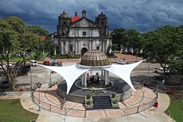 an aerial view of a large building with a white canopy over it's entrance