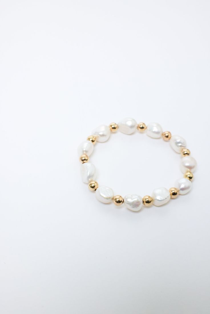 PG Designs Grace Bracelet Pearl like with Gold Beads Stretch Bracelet Can get wet Avoid chlorine and perfumes PG Designs Gold Stretch Bracelet, Bracelet Pearl, Gold Bead Bracelets, Pearl Design, Beaded Stretch Bracelet, Stretch Bracelet, Gold Beads, Pearl Bracelet, Stretch Bracelets