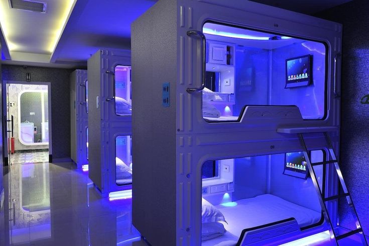 a room with bunk beds and blue lights