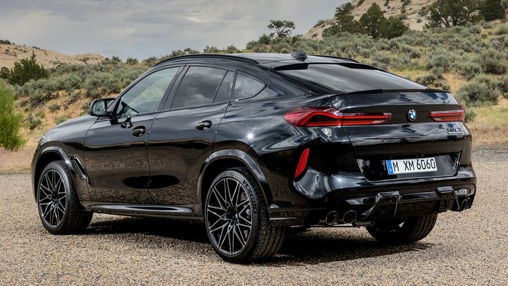 the rear end of a black bmw suv