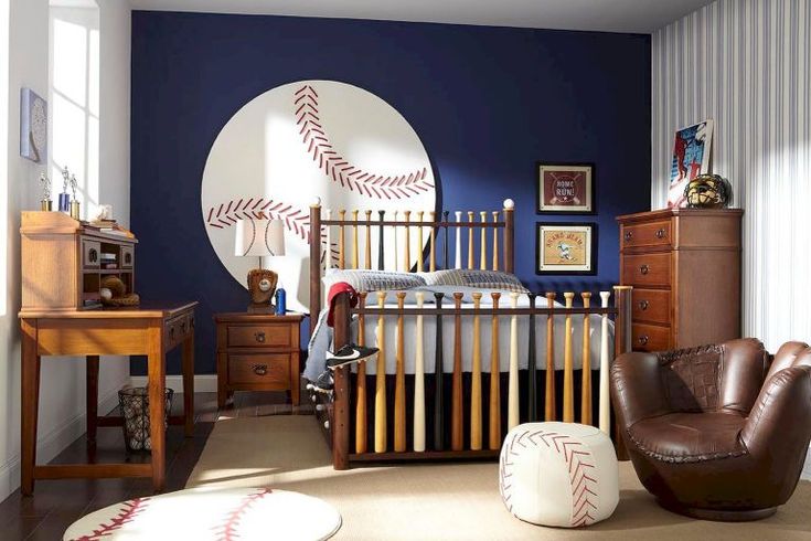 a child's bedroom decorated in blue and white with baseball themed wall decals