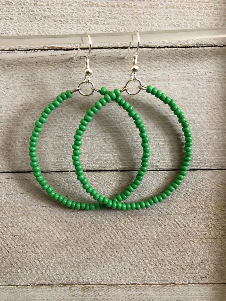 Hoop earrings are simple and lightweight. Seed beaded hoop earrings are 2 inches, handmade earrings will pair perfectly as a formal or casual accessory. Seed Bead Earrings * Perfect best friend gift!  * 2 inch earrings Earrings are READY TO SHIP TODAY!  ADD A BOX https://www.etsy.com/listing/1829605195/ MY ENTIRE COLLECTION https://www.etsy.com/shop/MiksJewelryShop   Thank you for supporting handmade and for visiting my corner of the internet. Please message me with any questions. Don't forget t Green Earrings With Colorful Beads, Green Bohemian Circle Earrings, Bohemian Green Circular Earrings, Green Bohemian Earrings For Everyday Wear, Green Bohemian Earrings For Everyday, Green Bohemian Hoop Jewelry, Bohemian Green Hoop Jewelry, Green Circle Bohemian Jewelry, Green Bohemian Circular Jewelry