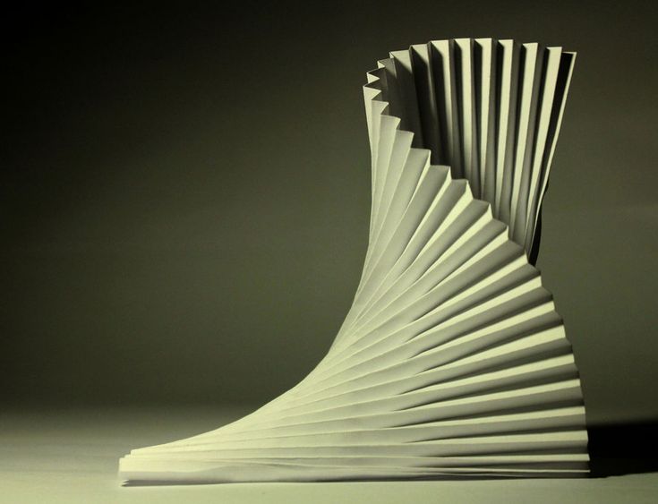 a white sculpture sitting on top of a table