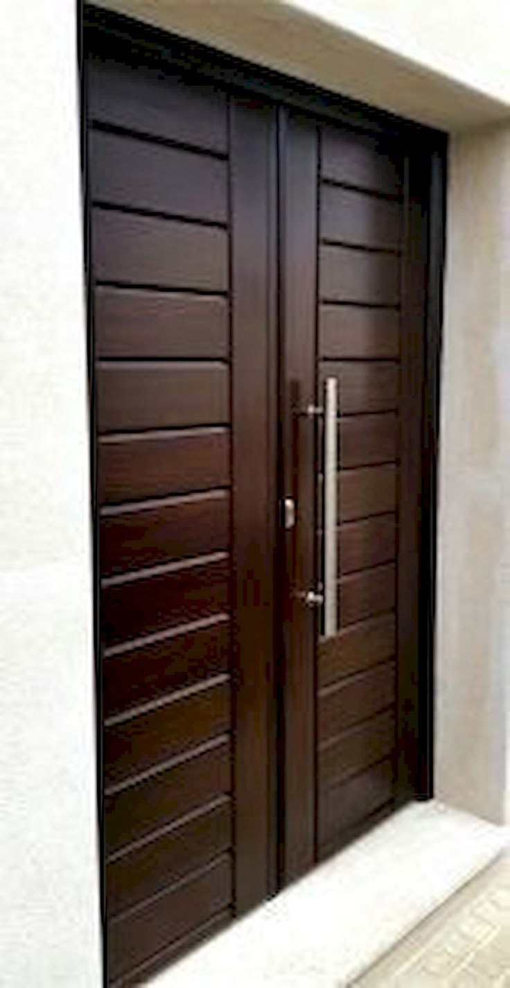 two brown wooden doors sitting next to each other