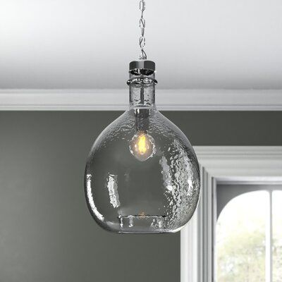 a glass light hanging from a ceiling in a room with gray walls and white trim