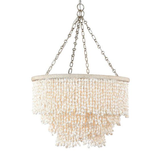 a chandelier with pearls hanging from it's chain on a white background