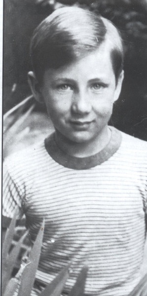 an old black and white photo of a young boy