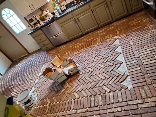 an open box on the floor in a kitchen