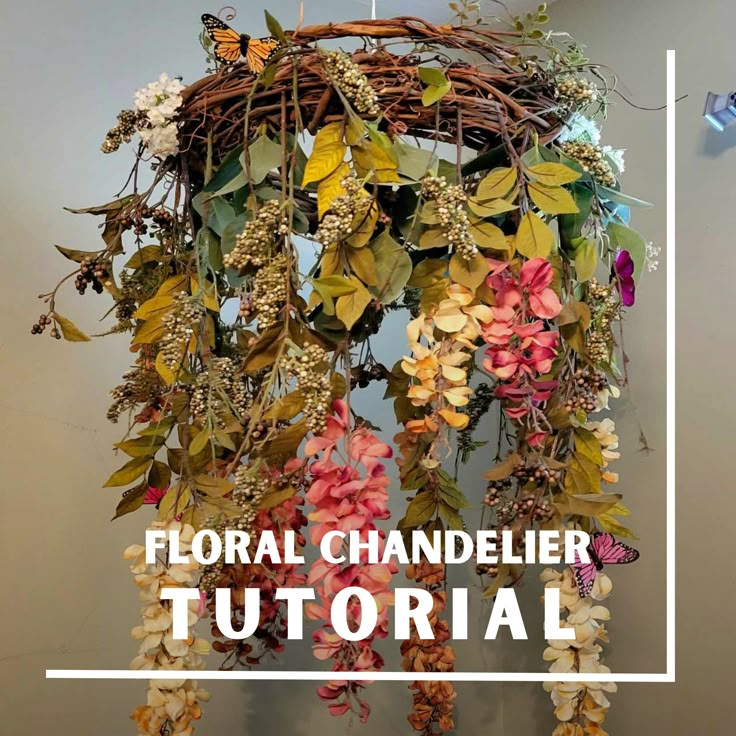 the floral chandelier is made with flowers and leaves