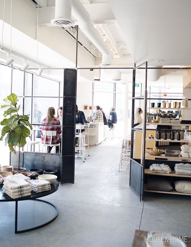 the interior of a store with people shopping