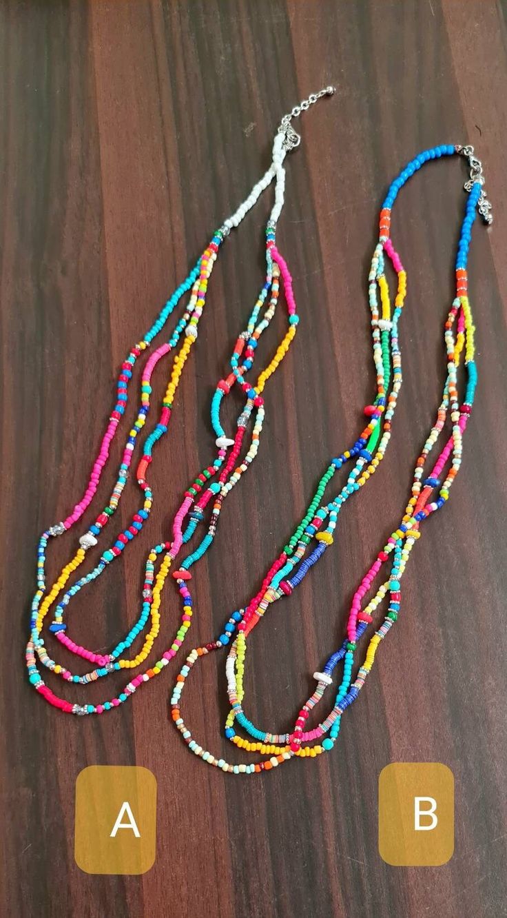 "Beautiful colorful vibrant multi beads multi-row summer necklace. This multi-layered multicolored necklace is made of mixed beads and seed beads. This Mexican multi-colored necklace is an ideal necklace for the Summer. The necklace is approx. 28\" long and has three rows. The drop length is approx. 13-14\". Available in two options: A and B * The products are handmade and shipped from India. * Package preparatiion time is 1 to 2 business days. * SHIPPING METHOD:  * Standard - It will take appro Summer Multi-strand Colorful Beaded Necklaces, Summer Multi-strand Beaded Necklaces, Colorful Multi-strand Beaded Necklaces For Summer, Summer Festival Multi-strand Beaded Necklaces, Beach Jewelry With Tiny Beads, Multi-strand, Multi-strand Beaded Necklaces For Summer, Multicolor Strand Necklace For Beach, Bohemian Multicolor Beaded Necklaces For Vacation, Adjustable Multi-strand Beaded Necklaces For Summer