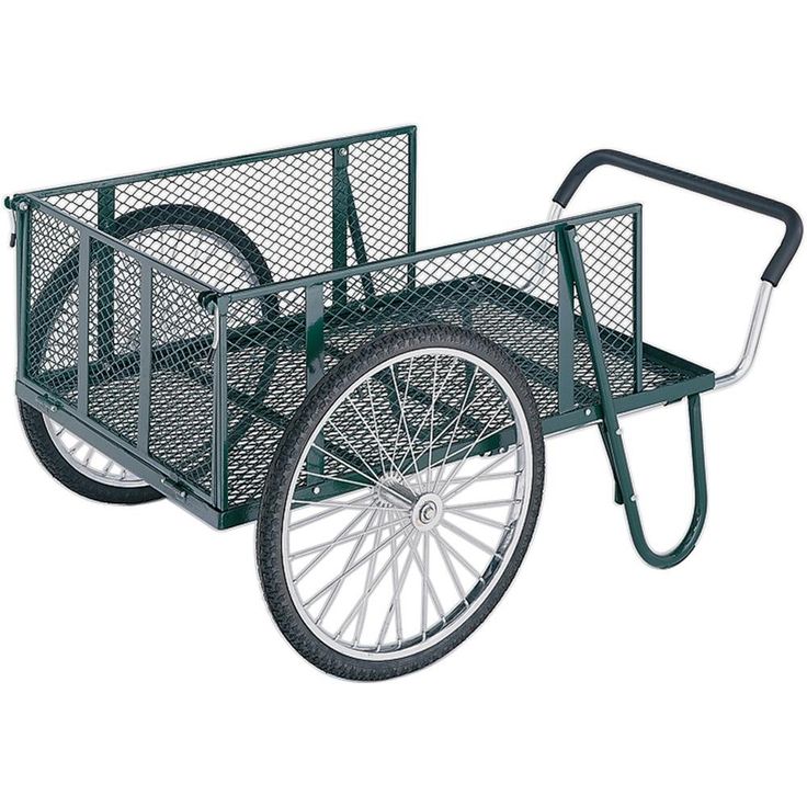 a green metal wagon with wheels and spokes