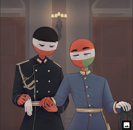 two people wearing masks standing next to each other