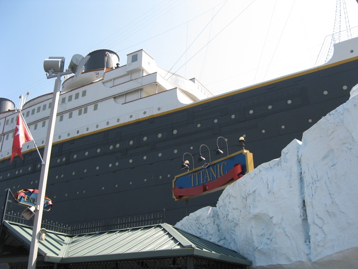 a large cruise ship docked at the dock with snow piled up on it's sides