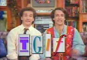 two men holding up letters that spell out the word git