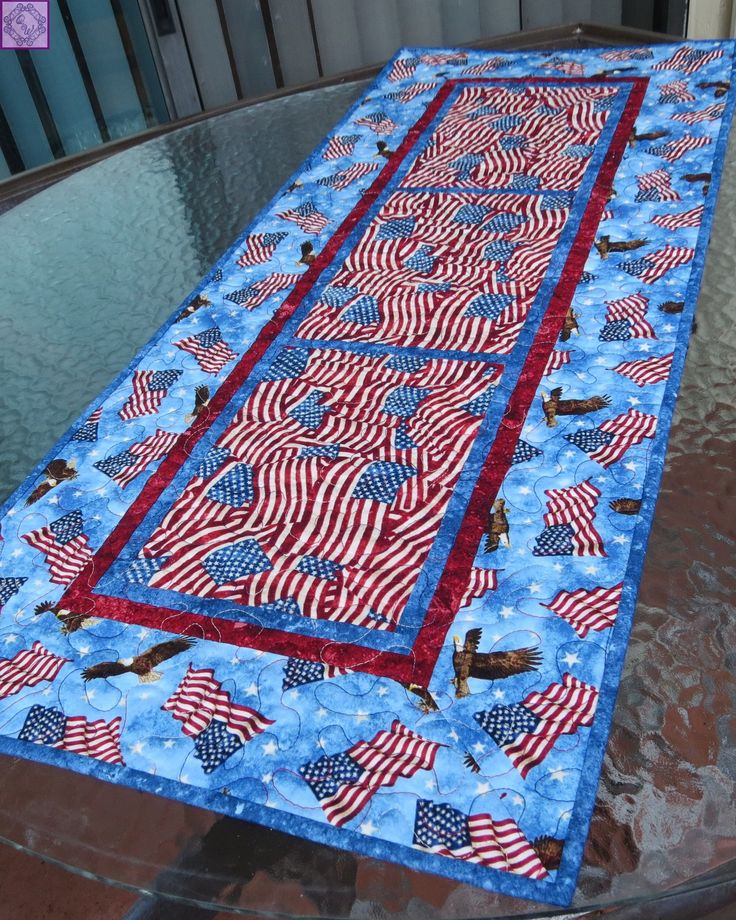 an american flag table runner on top of a glass table