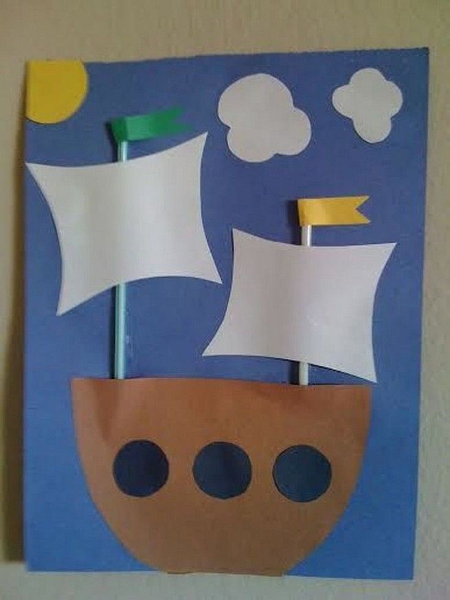 a paper cut out of a boat with two toothbrushes sticking out of it