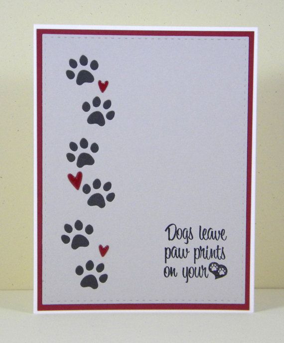 a dog paw prints on your heart card with the words dogs leave paw prints on your heart