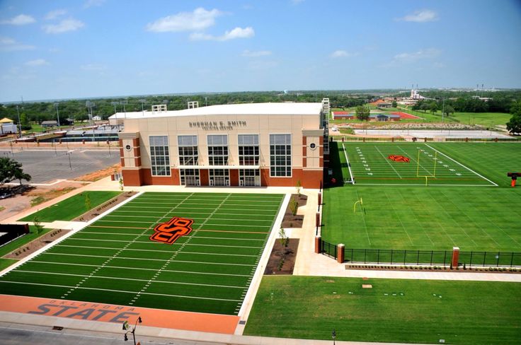 an aerial view of a football field with the sun shining on it