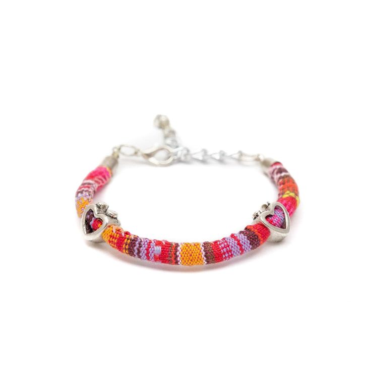 These fun, casual, and gorgeous bracelets are one of our best sellers and are perfect for adding some 'boho flair' to any outfit! Each piece features beautiful and colorful Guatemalan fabric wrapped around a bracelet that is detailed with silver beaded accents. Wear one or stack them - collect them all! As always... Handmade and Fair Trade! 7 1/2" L 100% Cotton Fabric Silver Beads and Clasp Colors/Patterns Will Vary Price is for one random Bohemian Fabric and Bead Bracelet WARNING: CHOKING HAZAR Hippie Multicolor Beaded Wrap Bracelet, Multicolor Bohemian Beaded Bracelets With Silver Beads, Bohemian Friendship Bracelets With Silver Beads, Colorful Beaded Bracelets For Festival, Pink Adjustable Beaded Hippie Bracelet, Bohemian Multicolor Bracelets With Silver Beads, Bohemian Colorful Beads Wrap Bracelet For Summer, Bohemian Wrap Bracelet With Colorful Beads For Summer, Multicolor Bohemian Beaded Bracelets