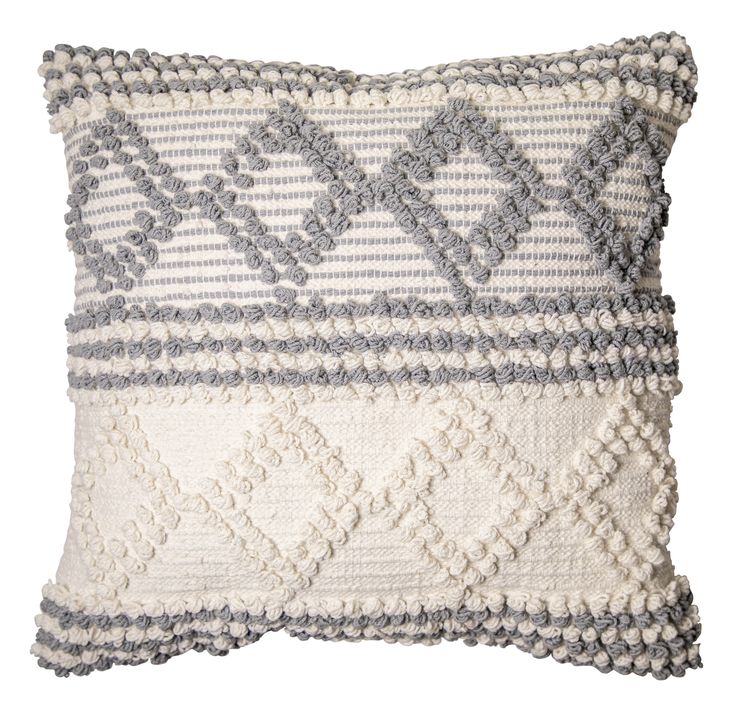 a gray and white pillow with fringes on it